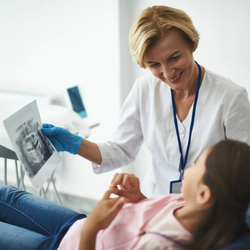 Image of dentist with a patient