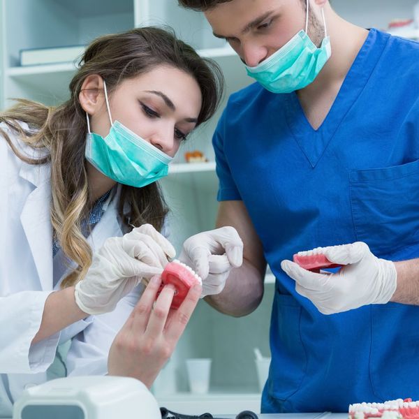 dentists looking at mouth