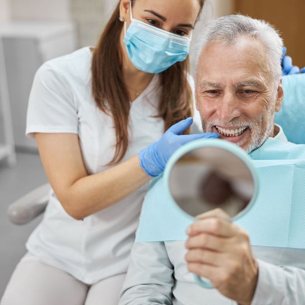 elderly man receiving dental implants