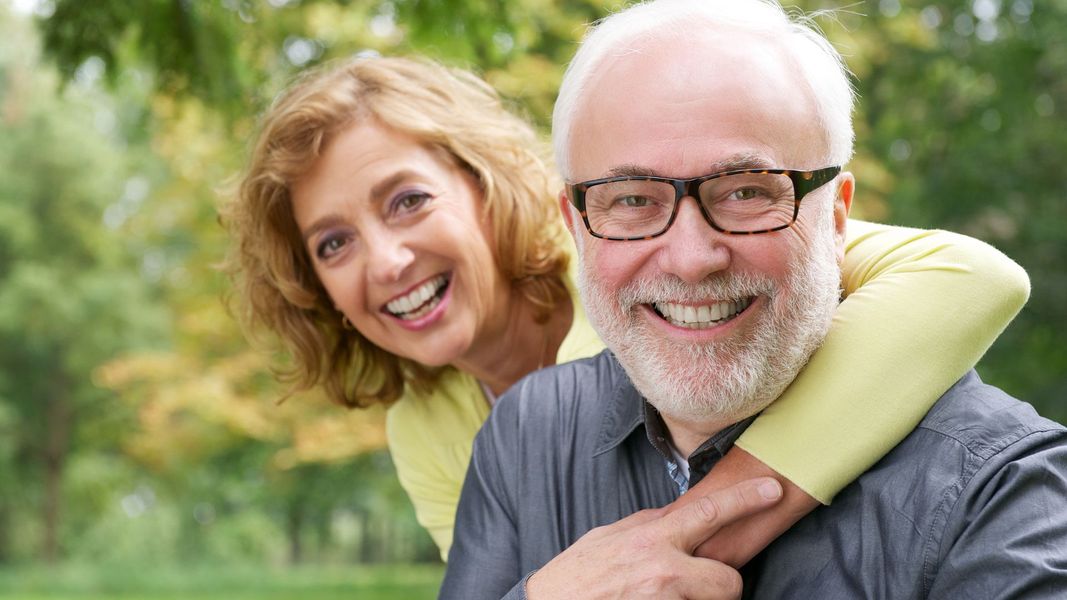 elderly couple smiling