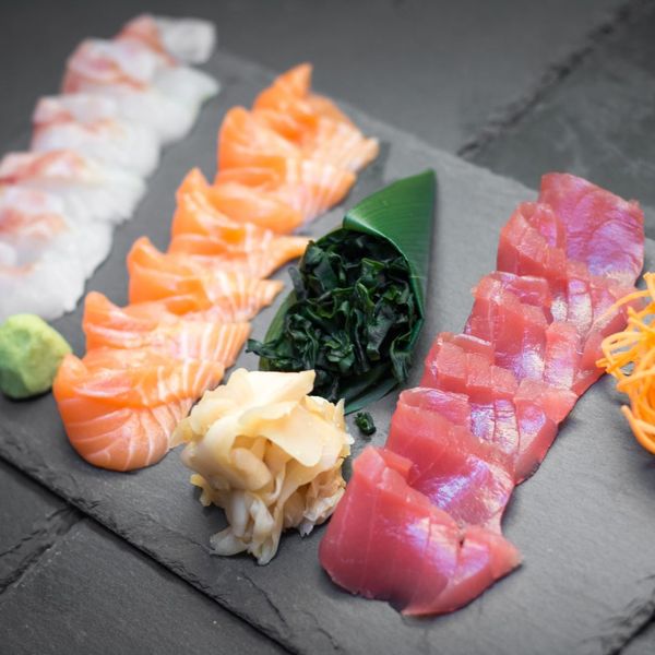 Different types of sashimi on serving plate