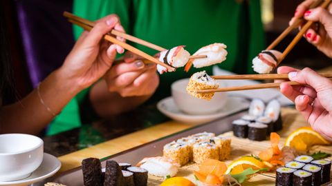 people sharing sushi