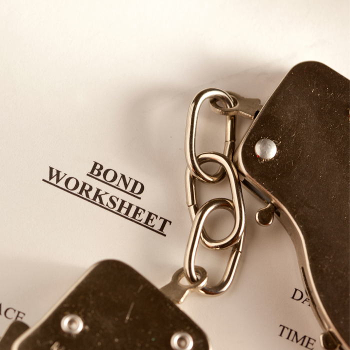 handcuffs on top of a bond worksheet How to Conduct a Miami Dade Inmate Search7.png