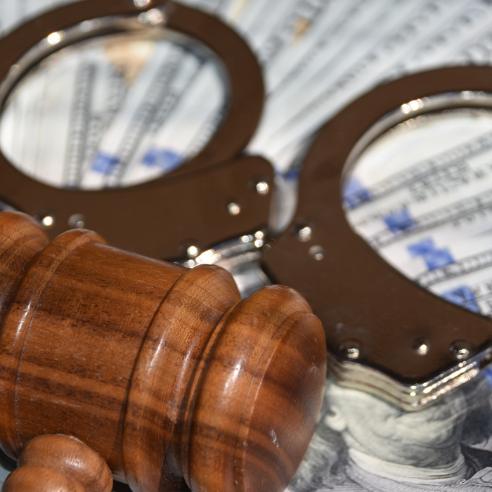 a gavel with handcuffs, representing money for bail How to Conduct a Miami Dade Inmate Search5.png