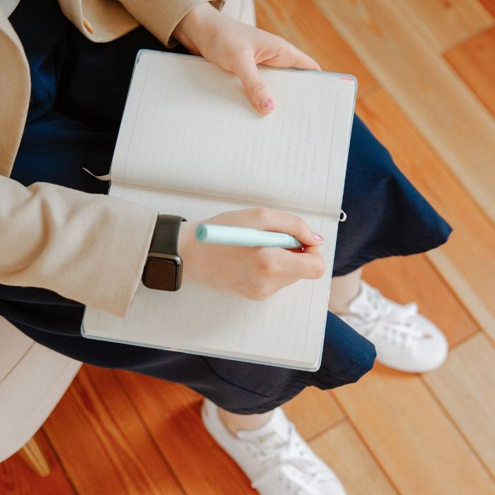 Woman taking notes.