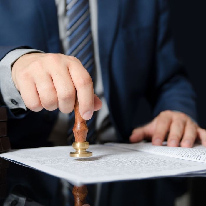 bail bond agent stamping a document bail bond agent stamping a document