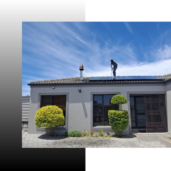 roofer standing on top of a roof