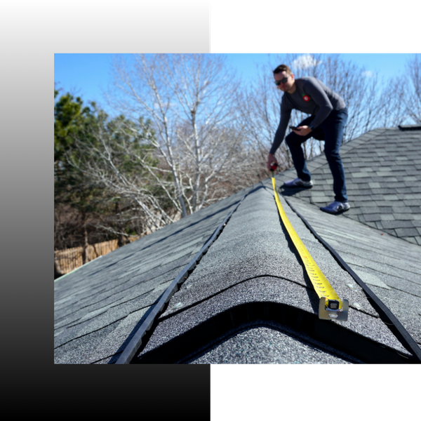 roofer measuring a part of a roof