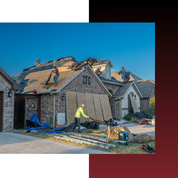 a team of roofers working on a brick home