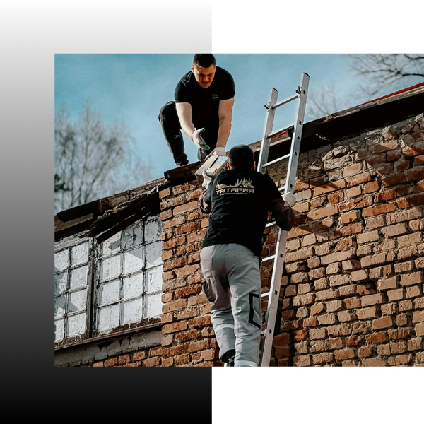 roofers repairing roof of a old building