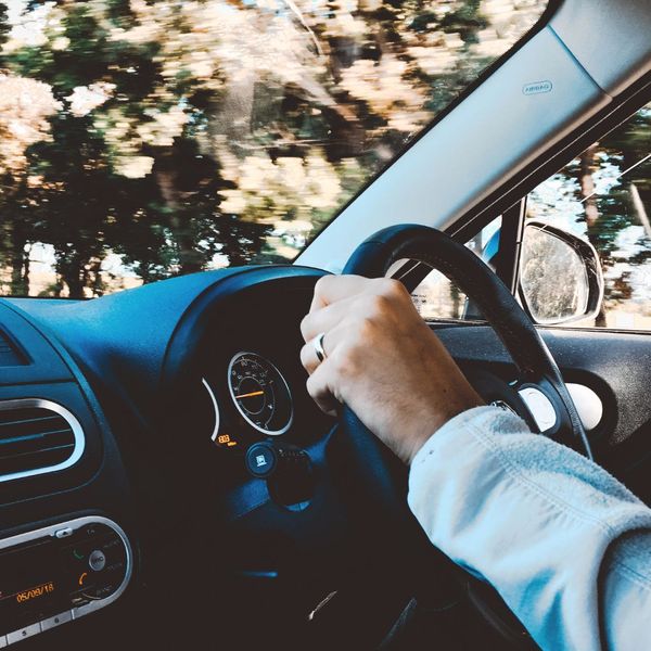 driver sitting behind steering wheel driver sitting behind steering wheel
