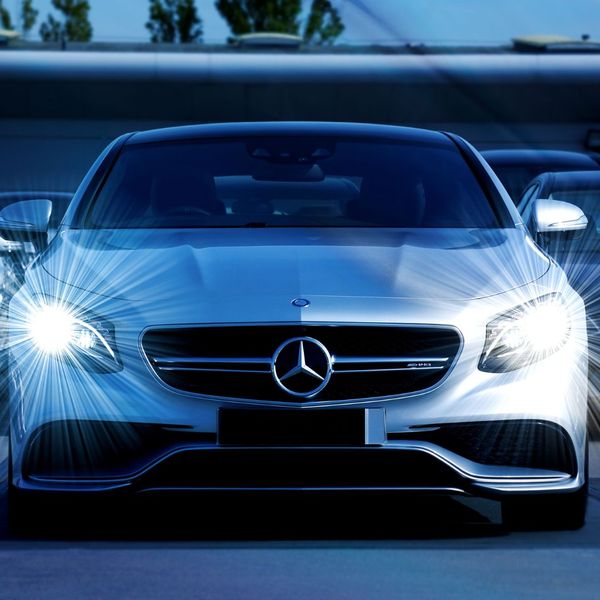 Mercedes with tinted windshield and headlights turned on Mercedes with tinted windshield and headlights turned on