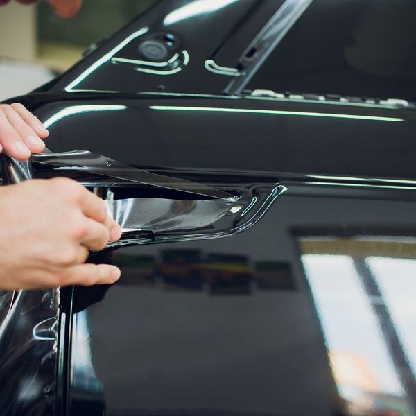 person applying paint protection film