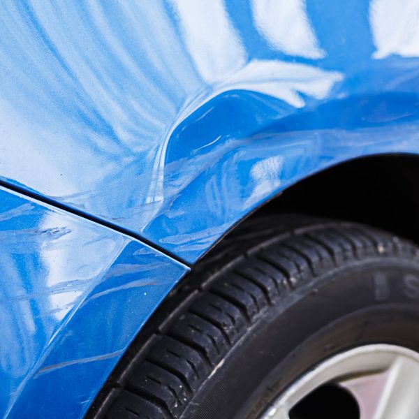 blue car with a dent and scratches blue car with a dent and scratches