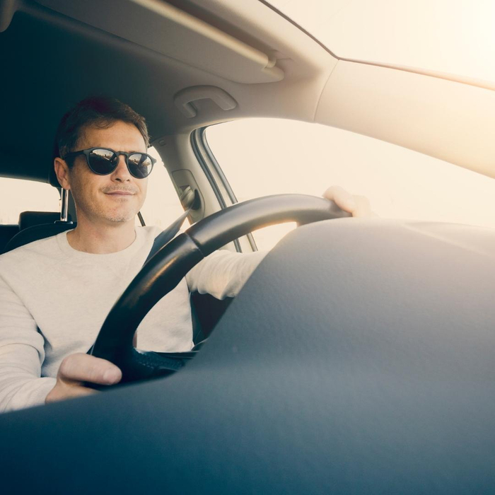 Man driving a car Man driving a car