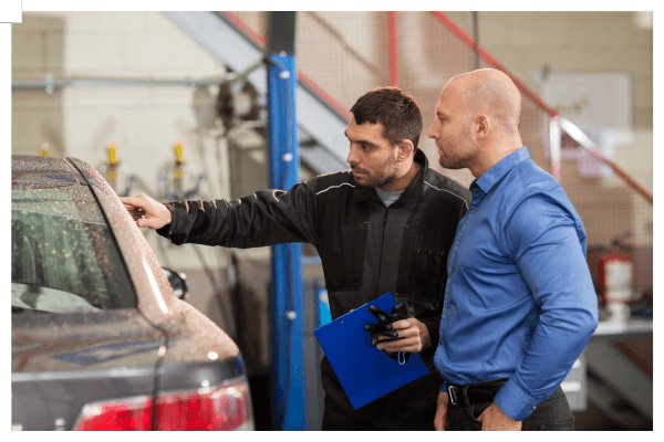 Technician discussing auto glass repair