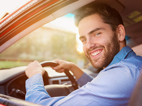 happy man driving a car