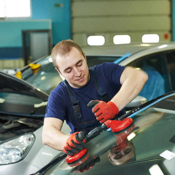 technician replacing windshield technician replacing windshield