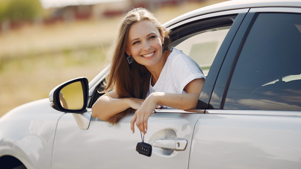 woman smiling in car