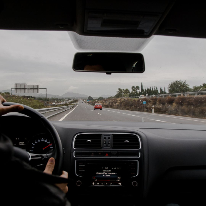 car driving down the highway 1080x1080-AutoGlassRepairPrevention2.jpg