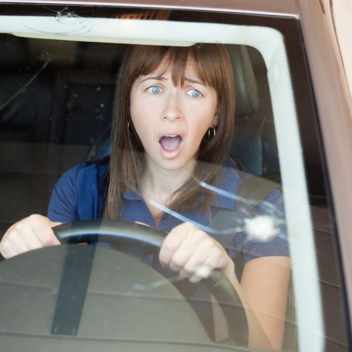 shocked woman with large windshield chips