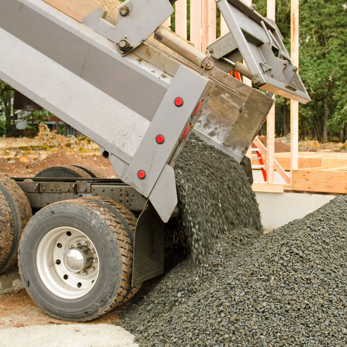 gravel truck dumping gravel