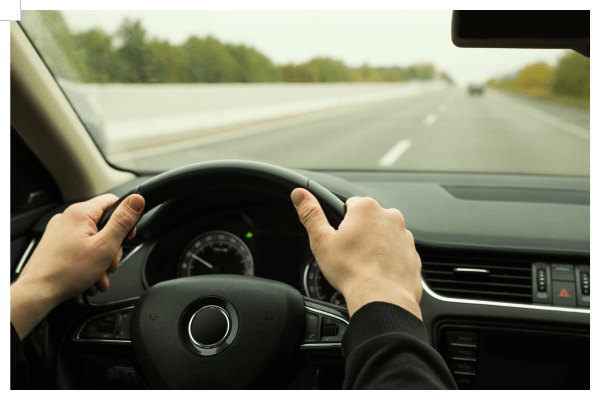 Hands on steering wheel, driving safely