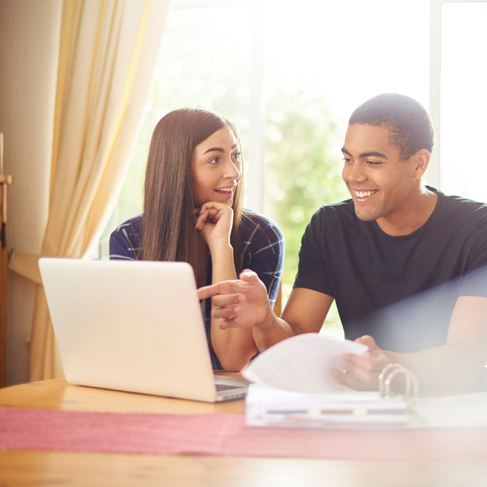 people on computer smiling