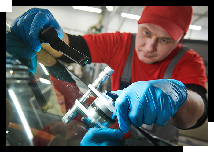 technician repairing windshield