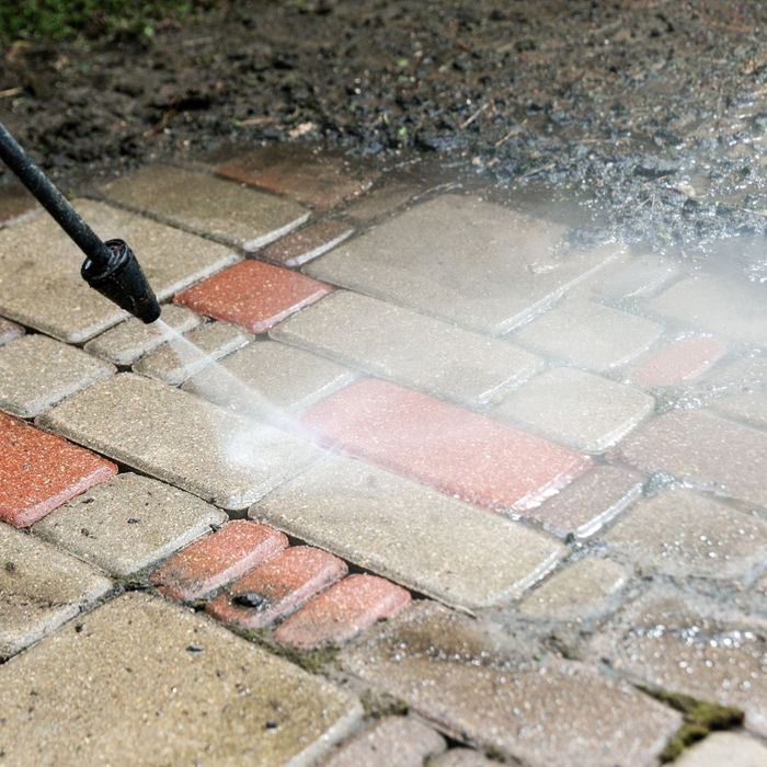 power washing a brick walkway