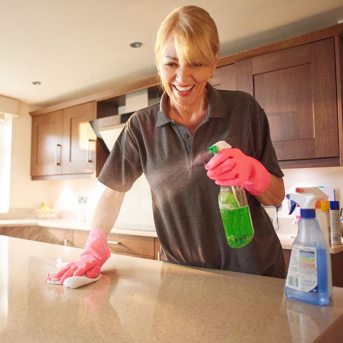 professional cleaner wiping counter