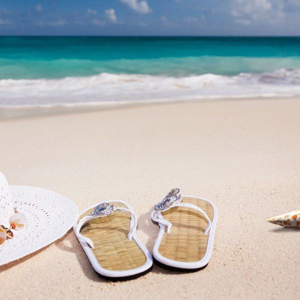 sandals and hat on beach