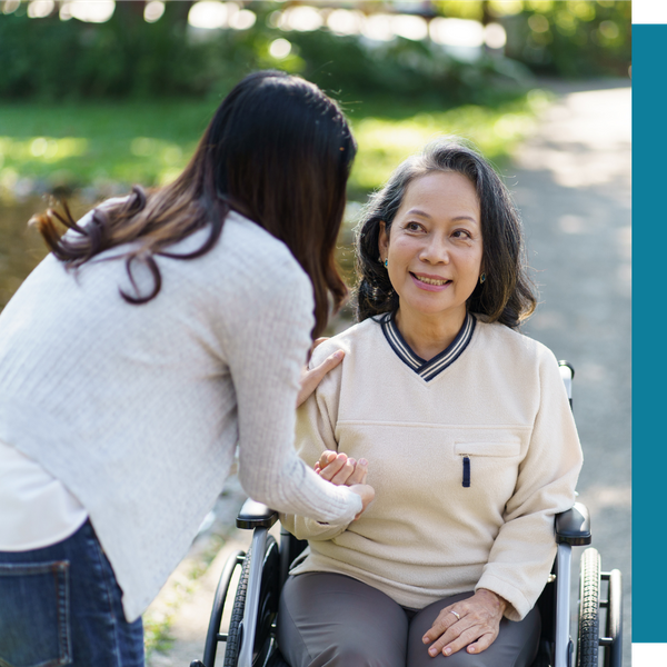 caregiver with older woman in wheelchair outside caregiver with older woman in wheelchair outside