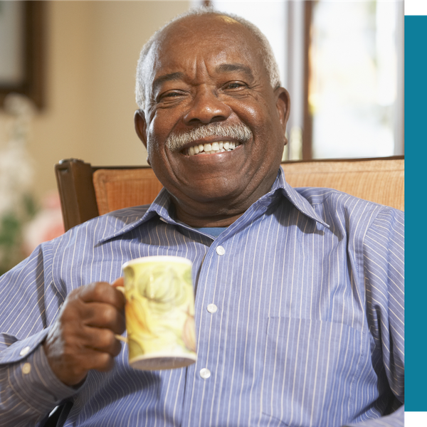 smiling older man with mug