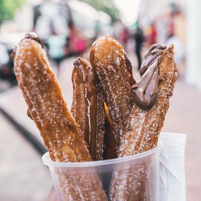 Fresh churros with chocolate drizzle