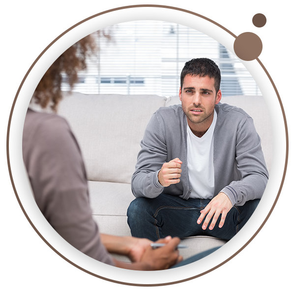 Man talking to therapist on couch