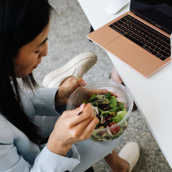 woman eating a salad woman eating a salad