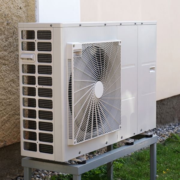 air source heat pump outside a building