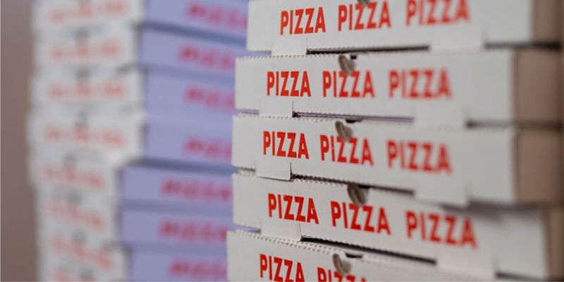 stack of pizza delivery boxes