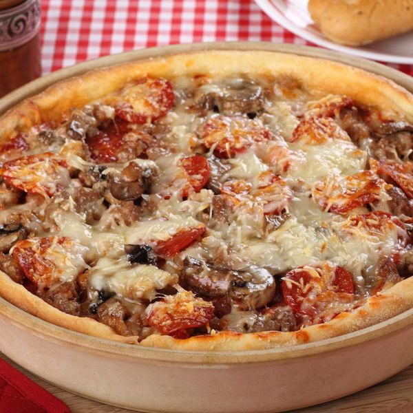 deep dish pizza with lots of toppings deep dish pizza with lots of toppings