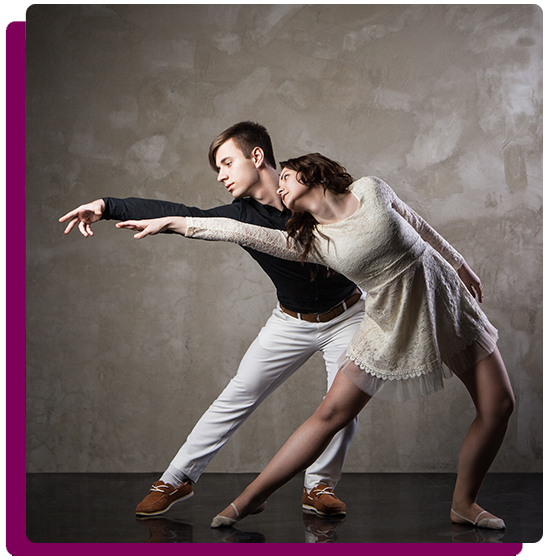 Male and female dancers practicing ballroom dancing.