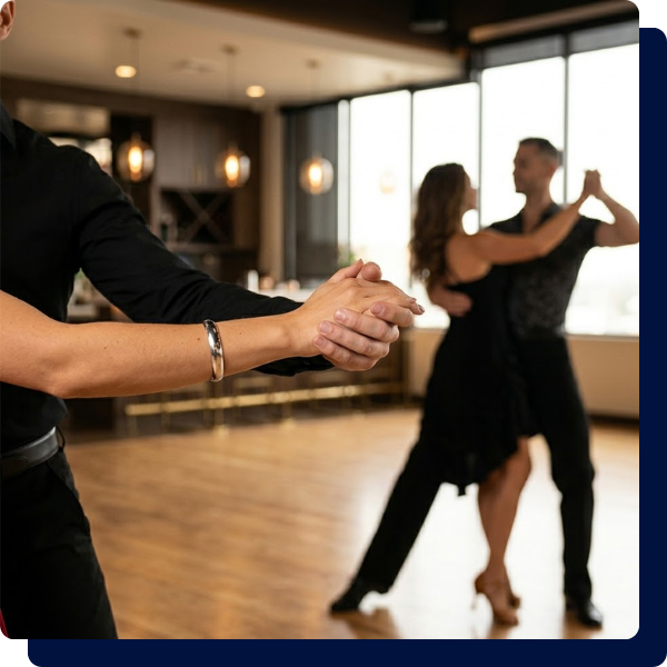 Close-up of dancing partners' hands demonstrating correct lead-and-follow connection and posture during a technical Latin dance class at Arthur Murray San Antonio.