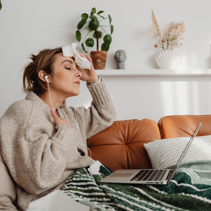 Woman wiping her brow