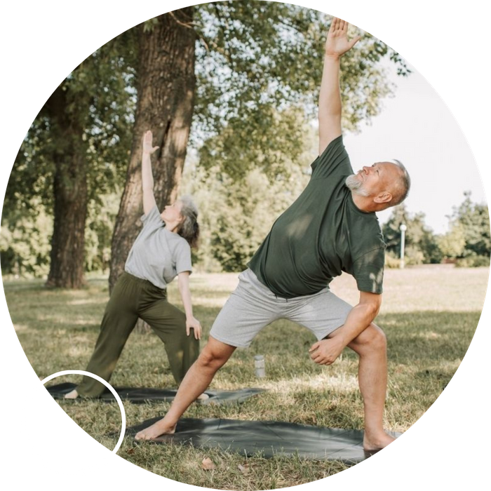 middle aged couple doing yoga