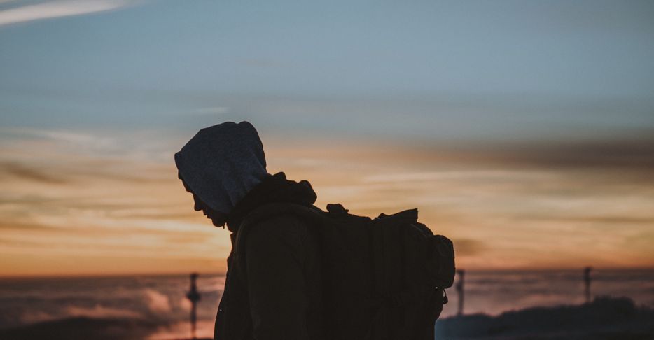Silhouette of a man with a backpack