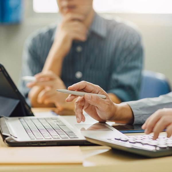 people working through financial information