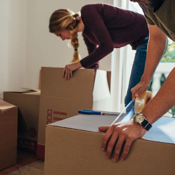 people packing moving boxes