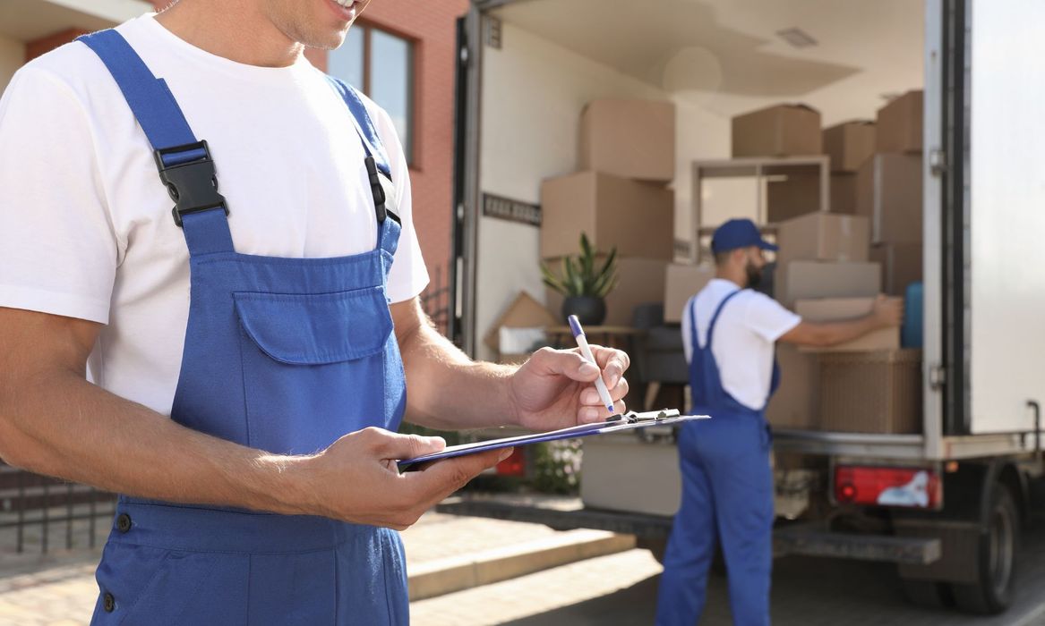 movers smiling in moving truck