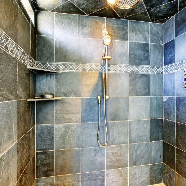 a multicolored tile shower