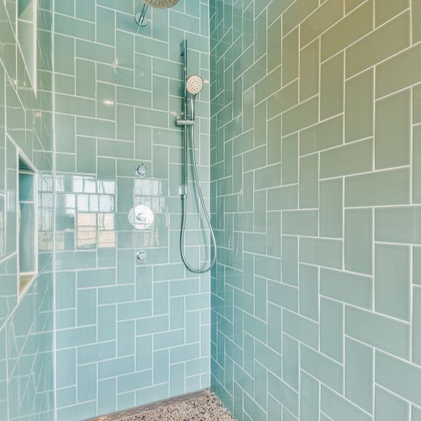 a green tiled shower